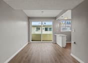 Thumbnail 10 of 62 - Open-Concept Kitchen, Dining, and Living Room Areas with Patio