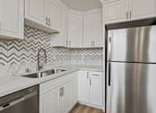 Thumbnail 9 of 62 - Kitchen with Double-Sinks, Refrigerator, and Dishwasher