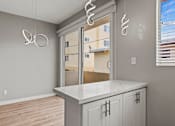 Thumbnail 11 of 62 - Kitchen and Dining Space with Countertop Bar