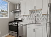 Thumbnail 7 of 62 - Kitchen with Stainless-Steel Refrigerator, Stove, and Dishwasher