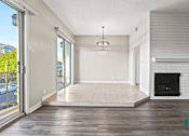 Thumbnail 40 of 62 - Open-Concept Living Room and Dining Room Space with Balcony and Double Glass Doors