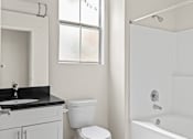 Thumbnail 20 of 65 - Bathroom with Bathtub and Cabinet Storage