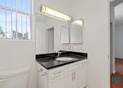 Thumbnail 43 of 65 - Bathroom with Vanity Cabinet Storage and Window