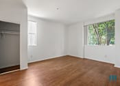 Thumbnail 47 of 65 - Bedroom with Large-Size Windows, Mirrored Closet, and Vinyl Flooring