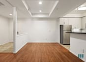 Thumbnail 29 of 65 - Front Entrance, Kitchen, and Dining Room Area