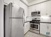 Thumbnail 27 of 65 - Kitchen with Stainless-Steel Appliances