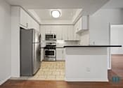 Thumbnail 32 of 65 - Kitchen with Stainless-Steel Refrigerator, Stove, Microwave Oven, and Dishwasher