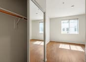 Thumbnail 19 of 38 - Bedroom with large Closet, Vinyl Flooring, and Large-Size Window