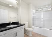 Thumbnail 29 of 38 - Bathroom with Bathtub and Cabinet Storage