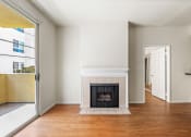 Thumbnail 14 of 38 - Living Room with Electric Fireplace and Patio