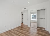 Thumbnail 41 of 71 - Bedroom with Mirrored Closet, Recessed Lighting, and Vinyl Flooring