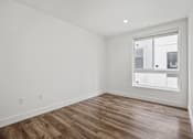 Thumbnail 42 of 71 - Bedroom with Large Windows,  Recessed Lighting, and Vinyl Flooring