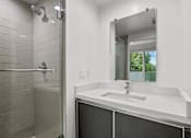 Thumbnail 39 of 71 - Bathroom with Stand-Up Shower and Vanity Cabinet Storage