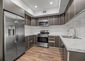 Thumbnail 56 of 71 - Kitchen with Energy-Efficient Appliances and Ample Cabinet Storage
