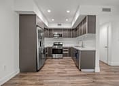 Thumbnail 50 of 71 - Kitchen with Energy-Efficient Appliances and Vinyl Flooring