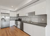 Thumbnail 25 of 49 - Kitchen with Ample Cabinet Storage at Gramercy Park by Wiseman, Los Angeles, CA, 90004