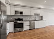 Thumbnail 24 of 49 - Kitchen with Efficient Appliances at Gramercy Park by Wiseman, Los Angeles