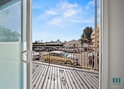 Thumbnail 31 of 48 - A view from a room looking out to a parking lot.
