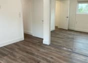 Thumbnail 18 of 39 - Bedroom with Mirrored Closet and Vinyl Flooring