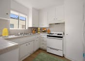 Thumbnail 2 of 39 - Kitchen with Stove, Refrigerator, and Ample Cabinet Storage