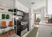 Thumbnail 6 of 62 - Kitchen with Stainless -Steel Refrigerator, Stove, Microwave Oven, and Dishwasher