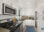 Thumbnail 40 of 65 - Kitchen with Energy-Efficient Appliances and Ample Cabinet Storage