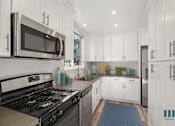 Thumbnail 18 of 65 - Full-Size Kitchen with Energy-Effcient Appliances and Ample Cabinet Storage