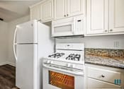 Thumbnail 10 of 65 - Kitchen with Refrigerator, Stove, and Microwave Oven