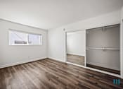 Thumbnail 13 of 65 - Bedroom with Large-Size Mirrored Closet and Vinyl Flooring