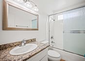 Thumbnail 14 of 65 - Bathroom with Shower Bath with Glass Door and Vanity Cabinet Storage