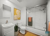 Thumbnail 6 of 71 - Bathroom with Shower Bath with Glass Door and Vanity Cabinet Storage