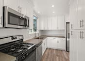 Thumbnail 19 of 65 - Apartment Full-Size Kitchen with Lots of Cabinet Storage