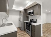 Thumbnail 15 of 39 - Apartment Kitchen with Energy-Efficient Appliances