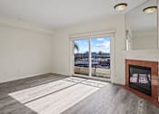 Thumbnail 10 of 48 - Large-Size Living Room Area with an Electric Fireplace and a Private Balcony