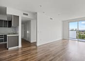 Thumbnail 16 of 71 - Open-Concept Kitchen, Dining, and Living Room Space with Patio
