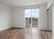 Thumbnail 20 of 71 - Bedroom with Mirrored Closet, Recessed Lighting, Vinyl Flooring, and Patio