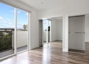 Thumbnail 23 of 71 - Bedroom with Double Mirrored Closet, Vinyl Flooring, and Balcony