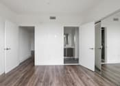Thumbnail 31 of 71 - Bedroom with Bathroom and Vinyl Flooring