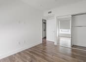 Thumbnail 30 of 71 - Bedroom with Mirrored Closet and Vinyl Flooring