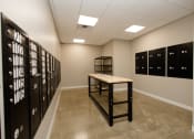 Thumbnail 14 of 31 - a room with lockers and a table in the middle