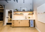 Thumbnail 6 of 31 - a kitchen with wooden cabinets and a white counter top