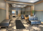 Thumbnail 4 of 17 - a seating area with couches and chairs
