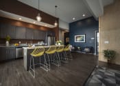 Thumbnail 34 of 44 - Clubhouse Kitchen Breakfast Bar with Stools at The Ivy at Berlin Place, South Bend, IN
