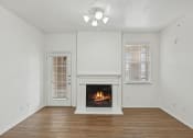 Thumbnail 3 of 15 - Living room with fire place at Cypress View Villa Apartments in Weatherford TX