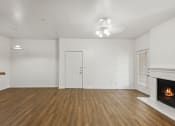 Thumbnail 4 of 15 - Living room with wood style flooring at Cypress View Villa Apartments in Weatherford TX