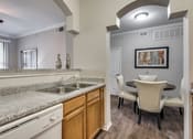 Thumbnail 1 of 31 - Open concept kitchen at Kensley Apartment Homes