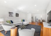 Thumbnail 7 of 21 - a living room with a couch and two chairs 1 bedroom