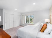 Thumbnail 29 of 42 - a bedroom with a bed and a window