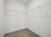 Thumbnail 22 of 43 - Empty room with a shelf on the wall.