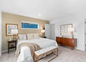Thumbnail 40 of 42 - a master bedroom with a bed and a dresser